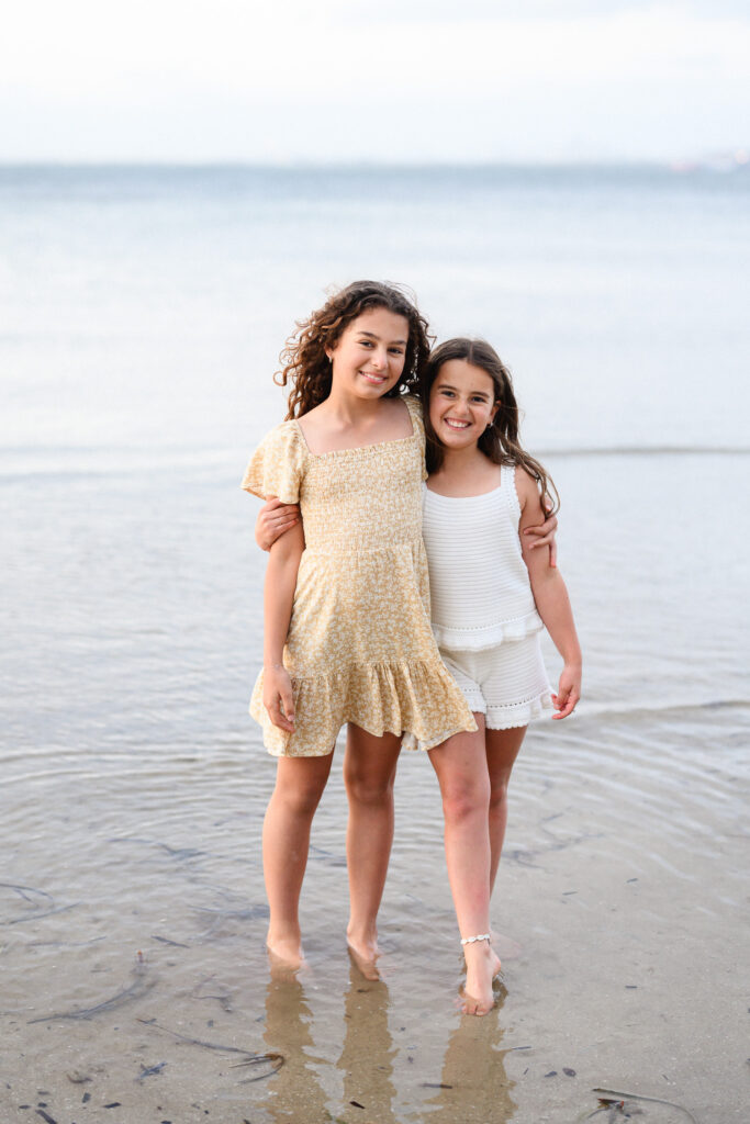 Sutherland Shire family photoshoot – sisters embracing in the water