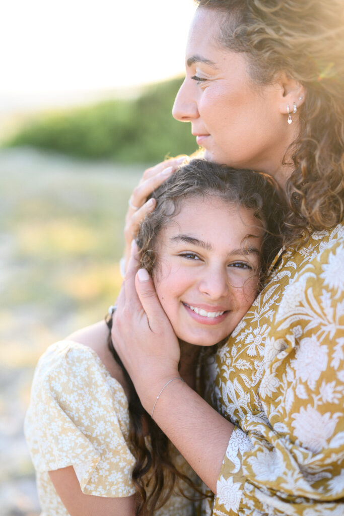 Sutherland Shire family photoshoot at the beach – mother embracing daughter gently